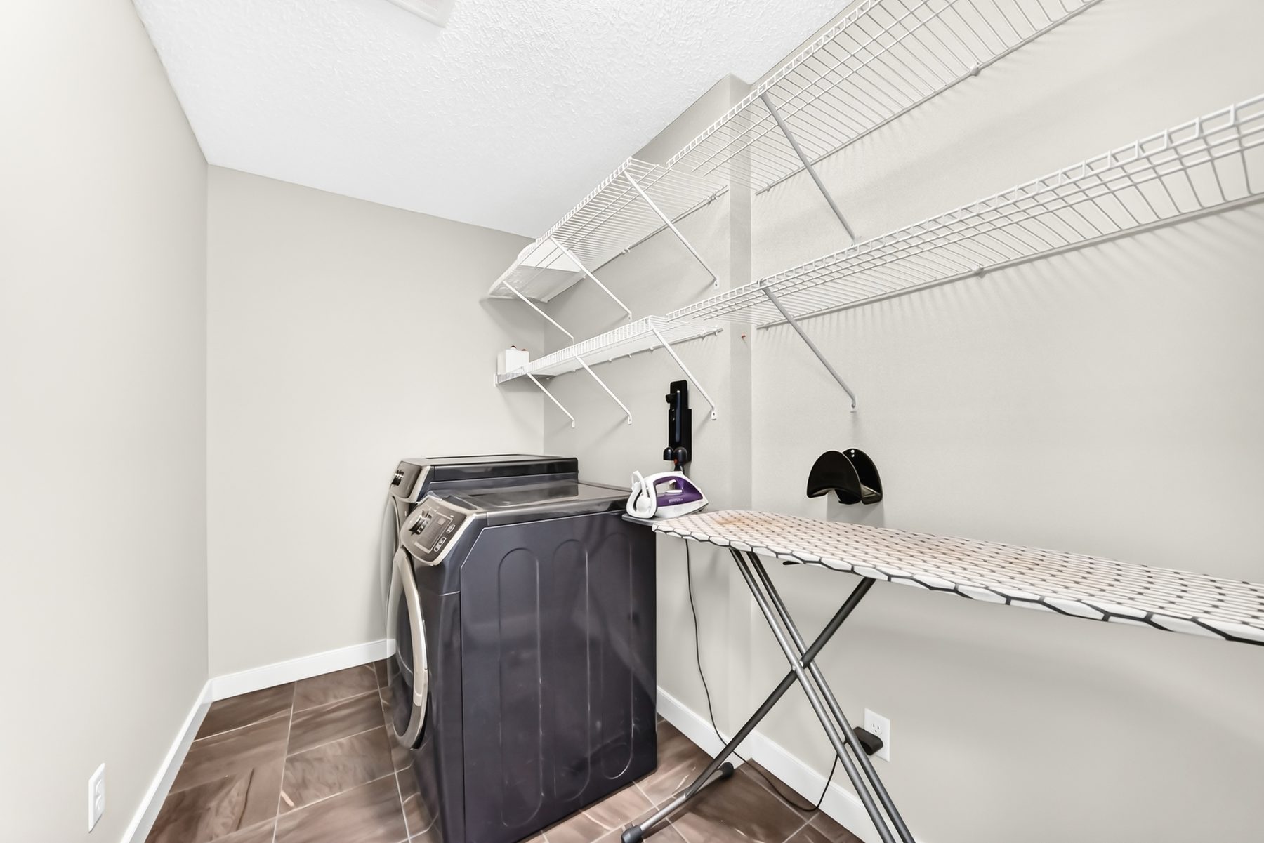 Primary walk-in closet with custom built-in organizers