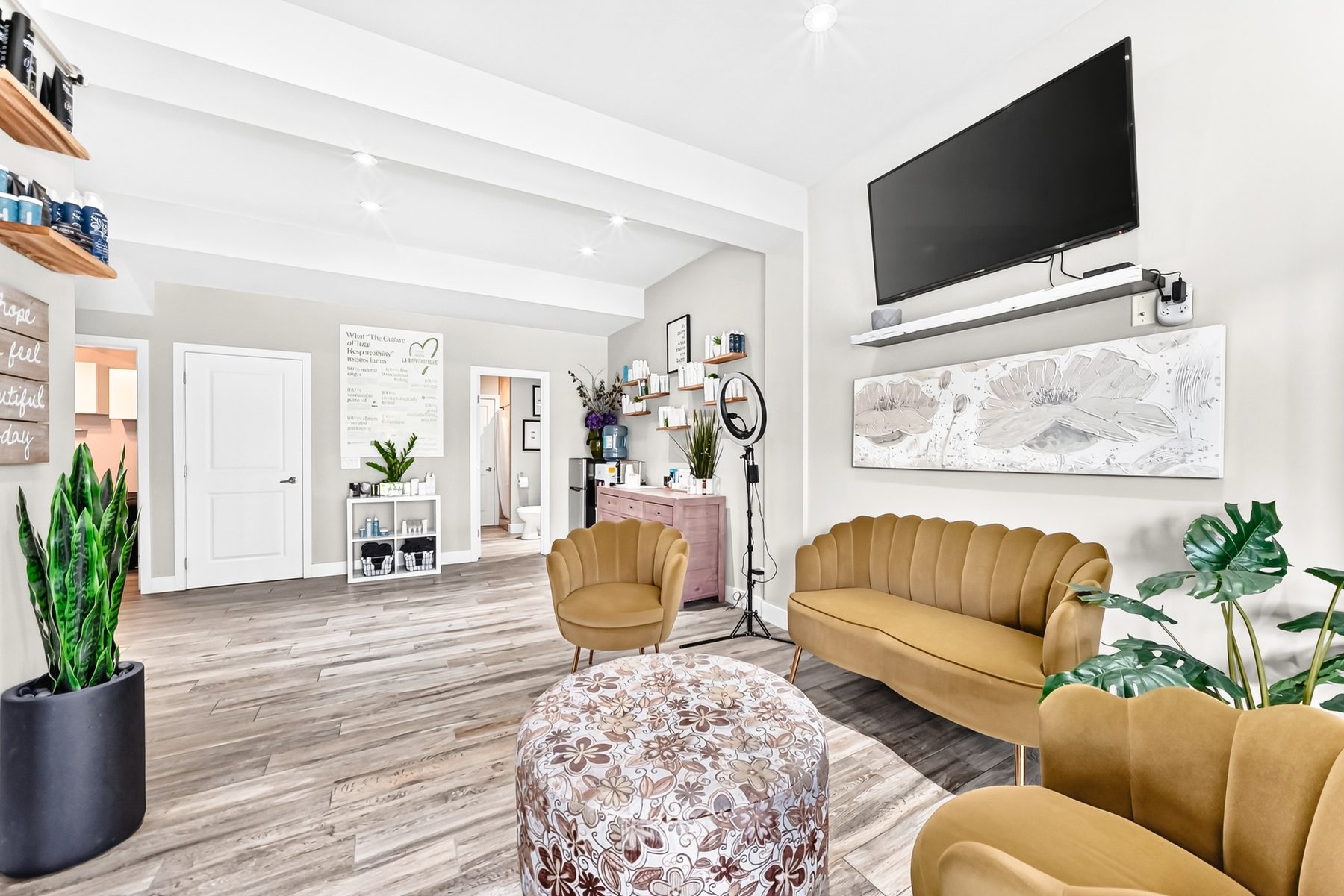 Sunny bonus room with vaulted ceiling and mounted TV